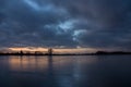 Cloudy sky after sunset, over a frozen lake Royalty Free Stock Photo