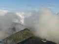 Cloudy sky at sunset over mountain top Royalty Free Stock Photo