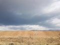 Cloudy sky view with a highway at background