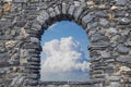 Cloudy sky view from an old stone window - freedom concept image Royalty Free Stock Photo