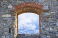 Cloudy sky view from an old stone window - freedom concept image Royalty Free Stock Photo