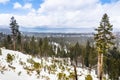 Cloudy spring day with snow covering the Sierra Mountains, Lake Tahoe in the background; Van Sickle Bi-State Park; California and Royalty Free Stock Photo