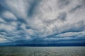 Cloudy storm in the sea before rainy. Tornado storms cloud above the sea. Royalty Free Stock Photo