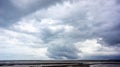 Cloudy storm in the sea before rainy. Tornado storms cloud above the sea. Monsoon season. Huge storm clouds with rain over sea , S Royalty Free Stock Photo