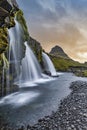 Cloudy sunrise at the iconic Kirkjufellsfoss waterfall in the The Snaefellsnes Peninsula, West Iceland