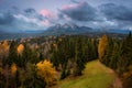 A cloudy sunrise over the autumnal Tatra Mountains. The pass over Lapszanka in Poland
