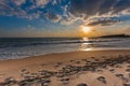 Cloudy sunset over a deserted beach Royalty Free Stock Photo