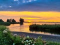 Panoramic view at a spectacular sunset on the beach at Veluwemeer, Gelderland province, Netherlands. Royalty Free Stock Photo