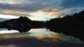 Cloudy sunset sky over the calm Loch Lomond, Scotland in autumn Royalty Free Stock Photo