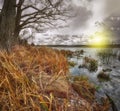 Cloudy weather over the lake at sunset Royalty Free Stock Photo