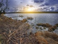 Cloudy weather over the lake at sunset Royalty Free Stock Photo