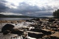 Cloudy weather at rocky sea shore Royalty Free Stock Photo