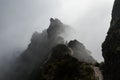 Mountain trail in clouds, narrow mountain ridge in fog, Pico do Areeiro peak, Madeira, Portugal