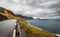 Cloudy And Windy Evening View of Road, Ocean and island in The Horizon. Faroe islands, Denmark,Europe