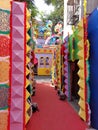 A clourful handmade gate with red carpet waiting for pandal hopping,kolkata,India
