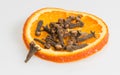 Clove with orange slice Royalty Free Stock Photo