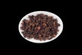 Clove spice in small white ceramic bowl Royalty Free Stock Photo
