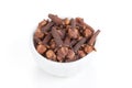 Clove in a white bowl on white background Royalty Free Stock Photo