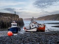 CLOVELLY, DEVON, ENGLAND - MAY 2 2023: Boats in the harbour at Clovelly, a small village on the Atlantic Ocean coast Royalty Free Stock Photo