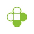 Clover leaf and cross logo design, medical healthcare icon, pharmacy symbol vector Royalty Free Stock Photo