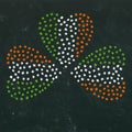 Clover Leaves Heart Shaped Colored in Ireland National Flag Colours Green, White, Orange. On a Black Board Background. St Patricks Royalty Free Stock Photo