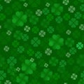 Clover quatrain seamless pattern. Irish Feast of St. Patrick Day. A lot of leaves scattered on a green background. Vector illustra Royalty Free Stock Photo