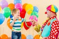Clown amusing child boy on birthday party Royalty Free Stock Photo