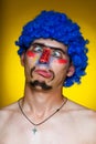 Clown in a blue wig Royalty Free Stock Photo