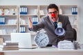 Clown businessman in the office angry frustrated with megaphone Royalty Free Stock Photo