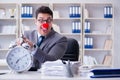 Clown businessman working in the office angry frustrated with a Royalty Free Stock Photo