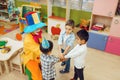 Clown with cheerful children play counting game