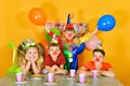 Clown child holds balloons up, holiday for birthday, happy birthday Royalty Free Stock Photo