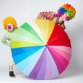 Clown with colorful umbrella on white Royalty Free Stock Photo