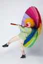 Clown with colorful umbrella on white Royalty Free Stock Photo