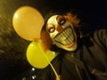 Clown evil bad laughing smile ballons redhead scary Royalty Free Stock Photo