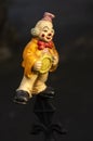 Clown figure as a toy with a sad and melancholy expression almost scary, scary look Royalty Free Stock Photo