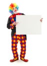 Clown holding blank white board Royalty Free Stock Photo