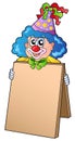 Clown holding information board