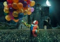 Clown is holding lots of balloons against a creepy background