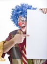 Clown holding sign Royalty Free Stock Photo