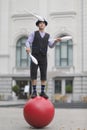 The clown juggles with white maces Royalty Free Stock Photo