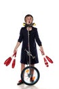 Clown with juggling clubs and a unicycle Royalty Free Stock Photo