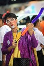 Clown making animal toy balloon for children