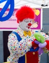 Clown making balloon animals