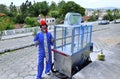 Clown Mineirinho with his popcorn cart standing on the street