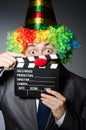 Clown with the movie Royalty Free Stock Photo