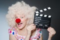Clown with movie Royalty Free Stock Photo