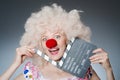 Clown with movie clapper Royalty Free Stock Photo