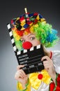 The clown with movie clapper in funny concept Royalty Free Stock Photo