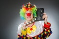 The clown with movie clapper in funny concept Royalty Free Stock Photo
